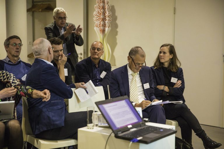 Jan van Rheenen (second from the right) at a symposium dedicated to his retiral from Kadaster. Jan Spijkerboer is not in the picture.